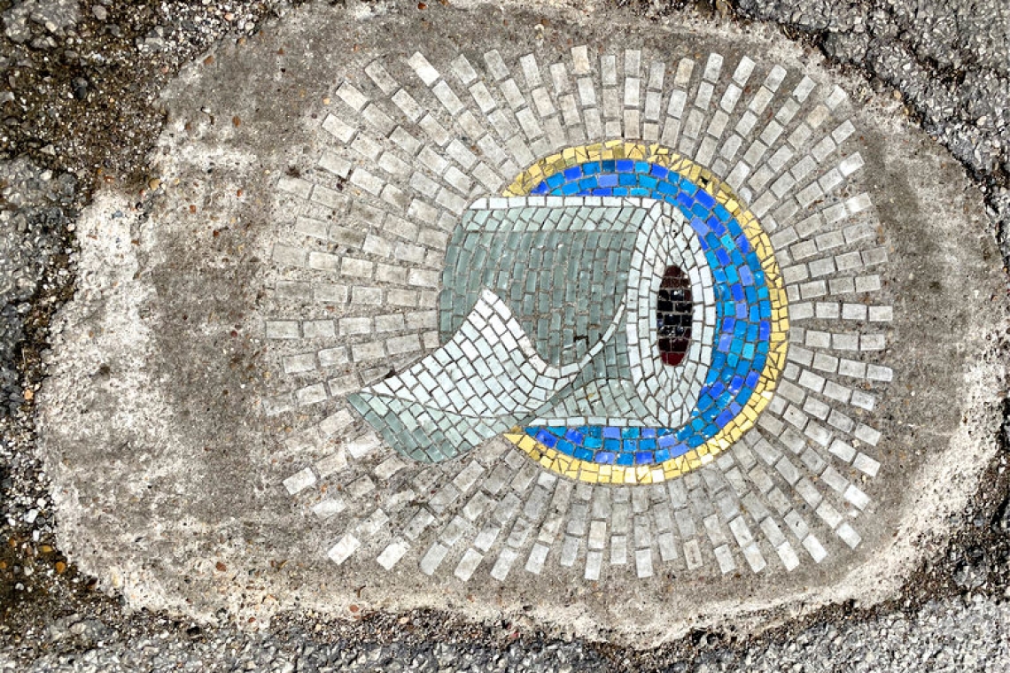 Chicago artist fills pesky potholes with pandemic art